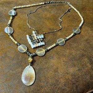 Chicos necklaces with tan beads and light green crystals